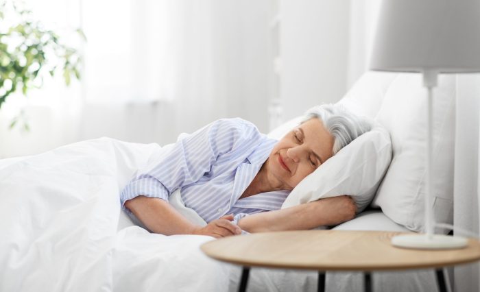 senior woman sleeping in bed at home bedroom Sleep and Aging: Why Rest Becomes More Important Over Time